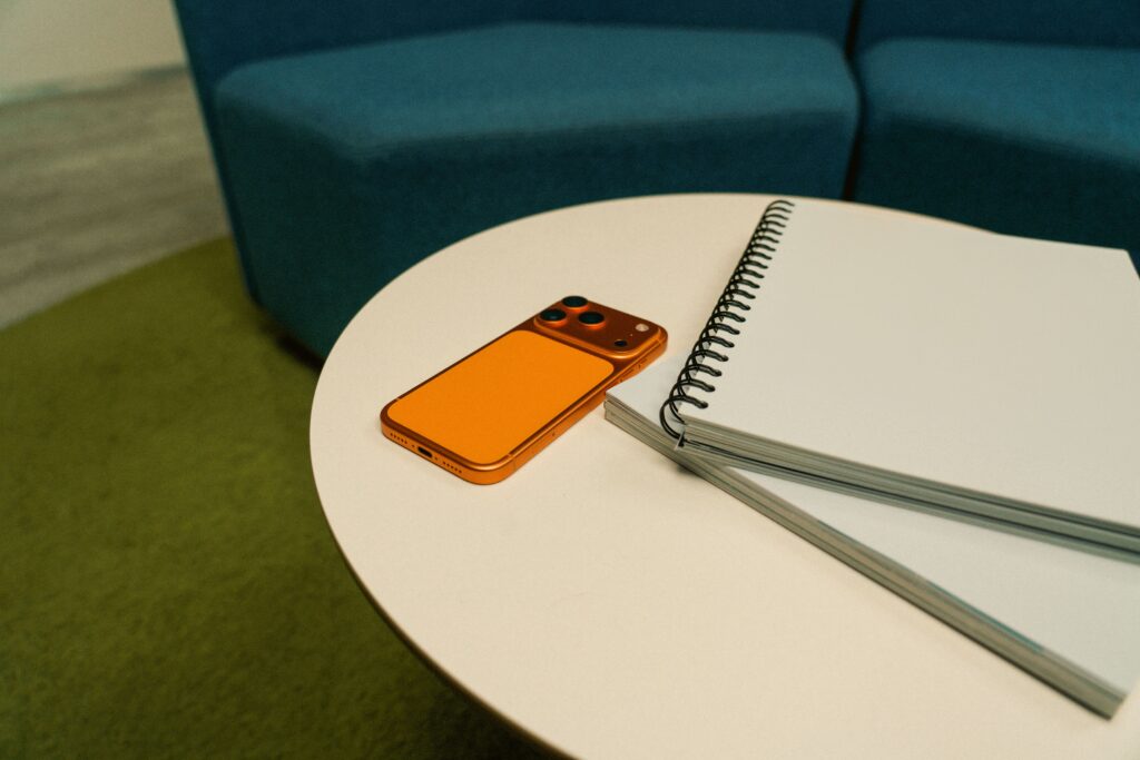 A person keeping their smartphone away on a table before going to bed